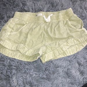2 Billabong Shorts, ones green one is pink and yellow, both are kids Medium
